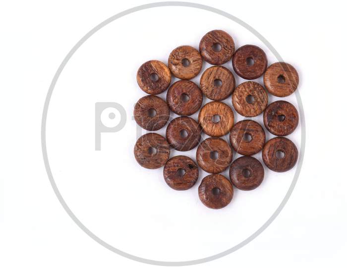 Wooden Beads On White Background. Top View.