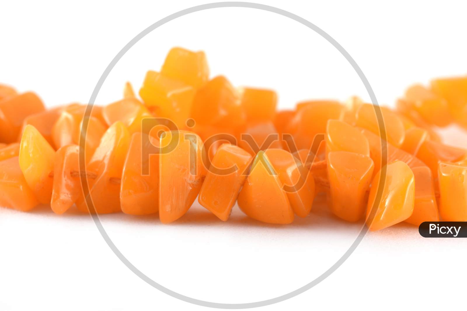 Image of Close Up Of Orange Beads On The White Background, Unshaped