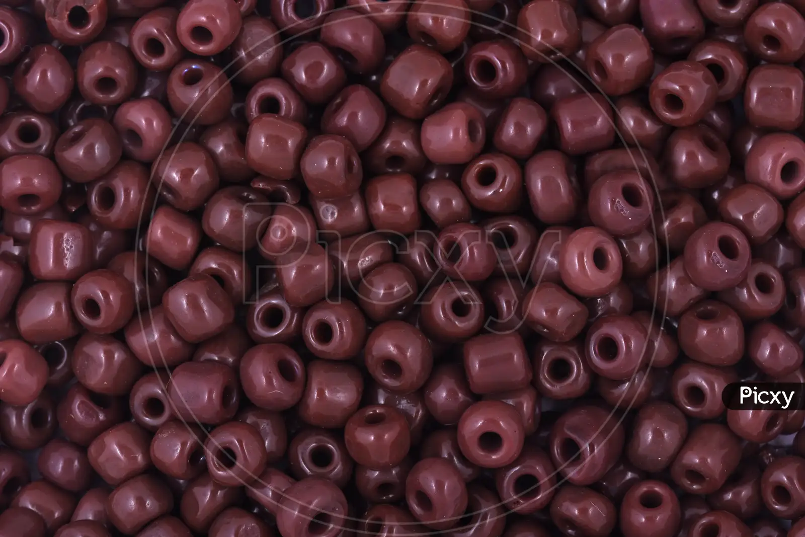 Image of Brown Beads On The White Background. Background Or