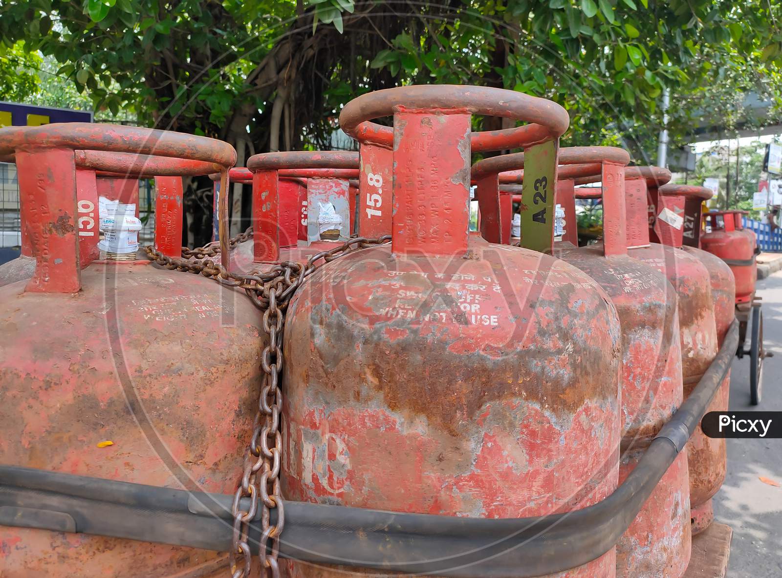 Lpg Or Liquid Petroleum Gas Cylinder Kept Together Tighten With Iron Chain