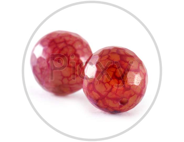 Patterned Crimson Red Agate Beads Isolated On White,Round Agate Beads,Semi Precious Stones. Natural Mineral Beads. Beads Made Of Natural Stones To Create Jewelry.