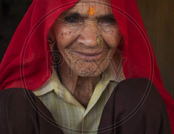 Indian woman portrait with traditional Indian colourful Dress and looking at camera