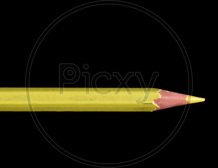 Yellow pencil isolated on black background