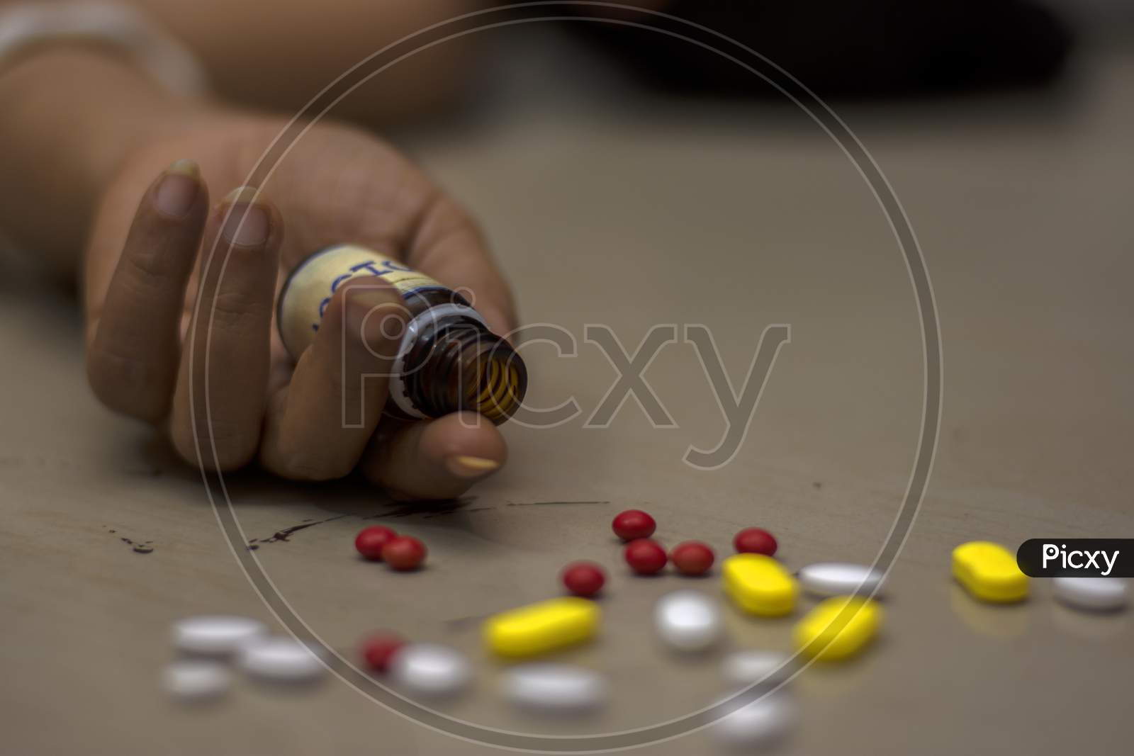 Bottle Of Poison Pills In A Female'S Hand Committing Suicide By Overdosing Of Medication.