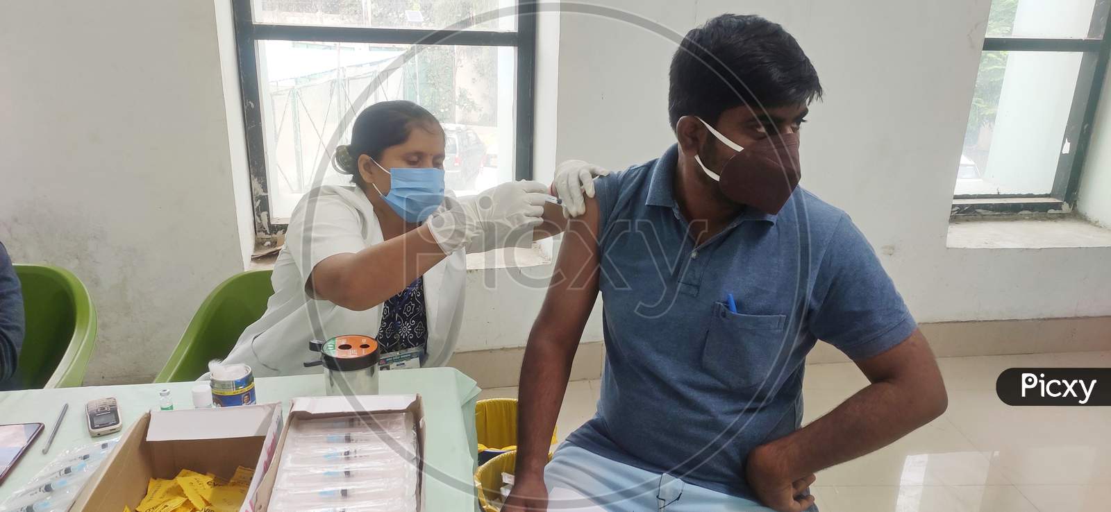 June 10 2021, Kanpur, India. An Young Man Wearing Mask And Getting Corona Vaccination In Green Park, Kanpur.