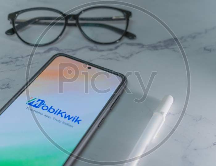 Mobile Phone Screen Showing Mobikwik Logo An Indian Unicorn Startup Payment And Recharge Digital Wallet Service Provider Competing With Paytm And Google Pay In India