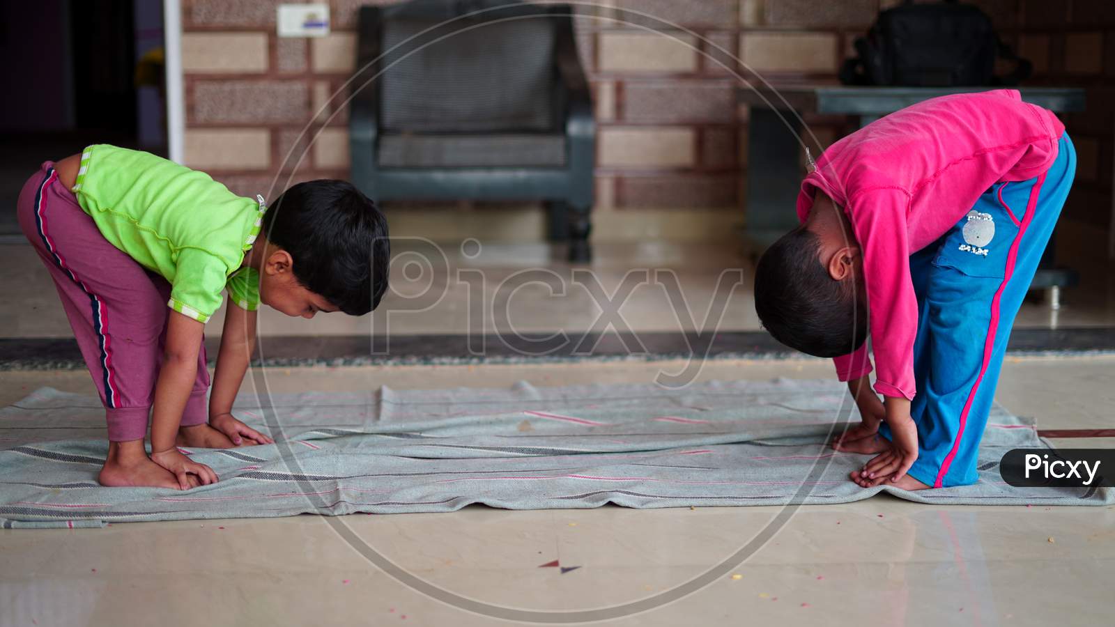 Asian Children Exercising At Home. Family Working Out At Home. Worldwide Yoga Day Concept.