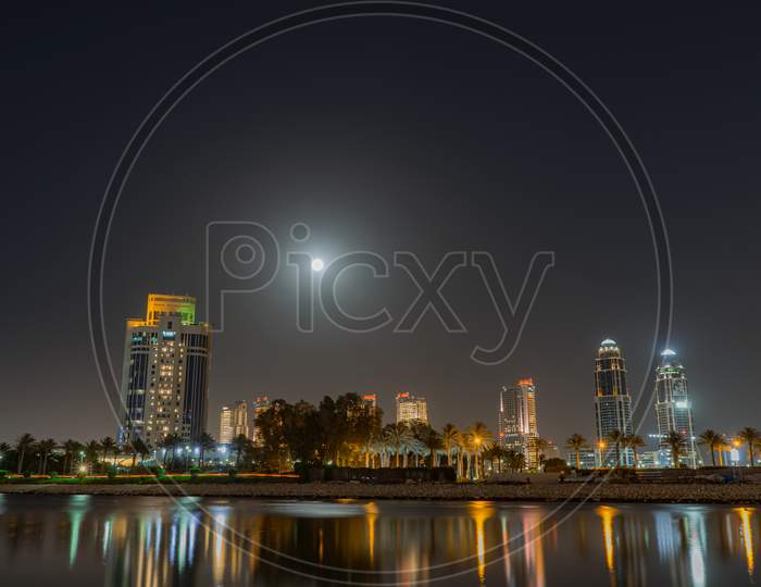 Cityscape at night under Supermoon