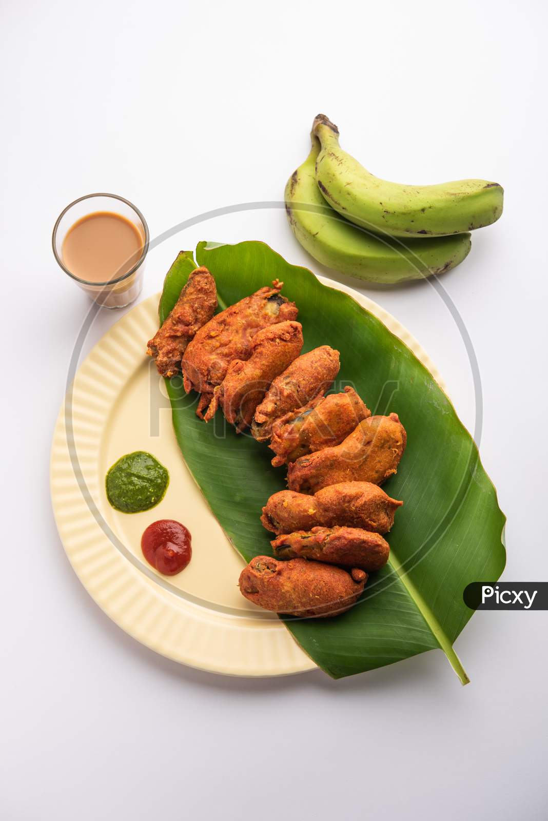 Image of Banana Fritter Or Pakora Or Raw Kela Pakoda Or Bajji Served