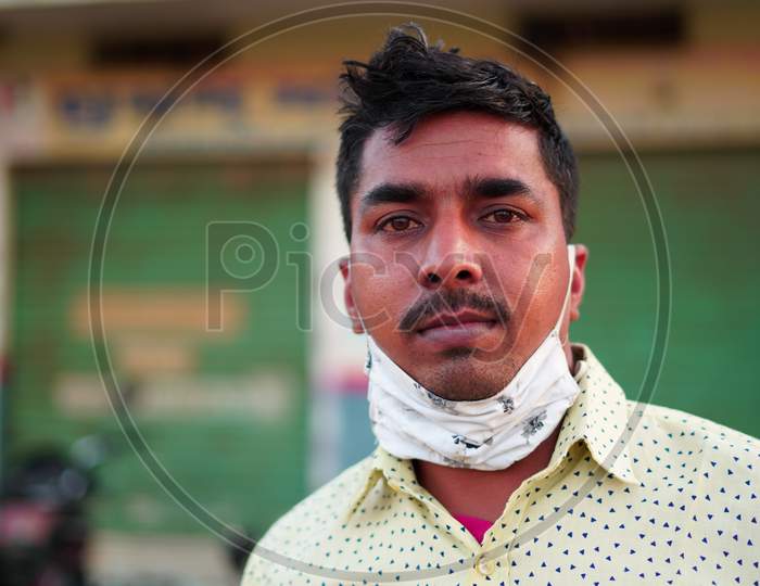 Image Of Front Shot Of Indian Man Wearing Mask And Shirt Over Blur image-of-front-shot-of-indian-man-wearing-mask-and-shirt-over-blur