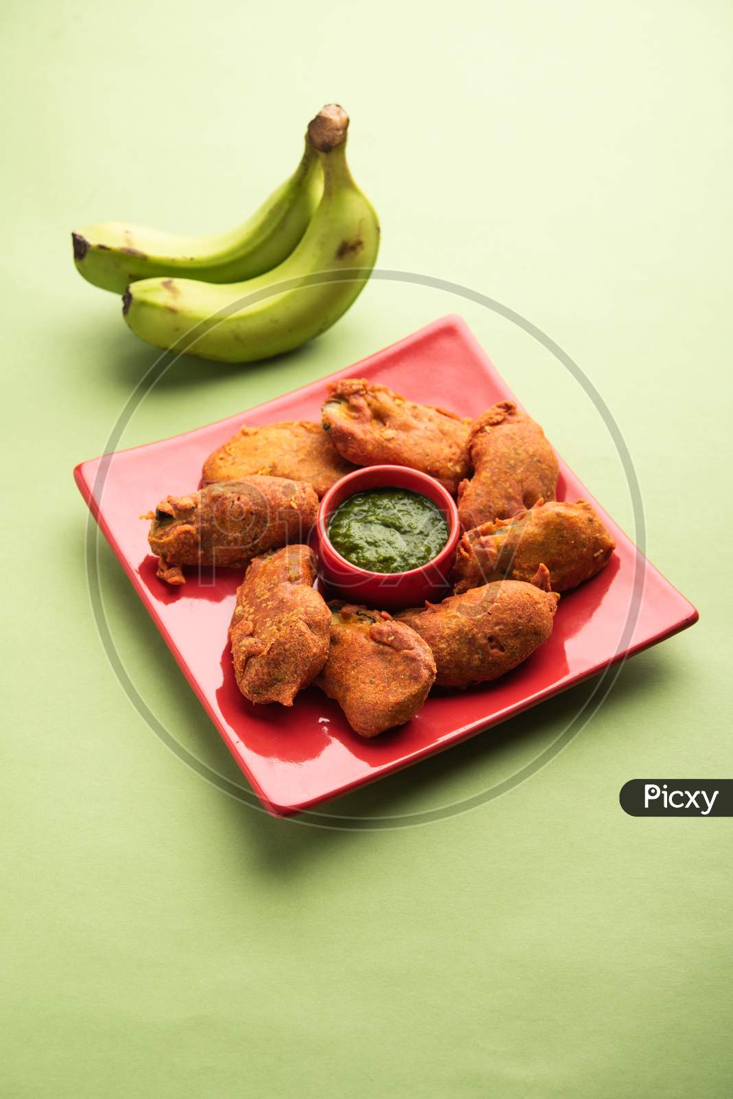 Image of Banana Fritter Or Pakora Or Raw Kela Pakoda Or Bajji Served ...