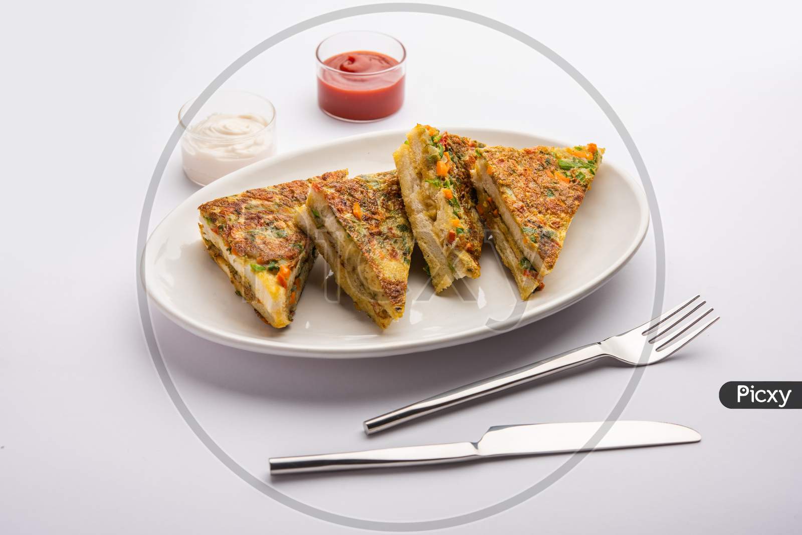 Bread Omelette Is A Quick And Easy Breakfast From India. Fresh Bread Slices Dipped Into Egg Batter With Spices And Shallow Fried. Served With Tomato Ketchup And Tea