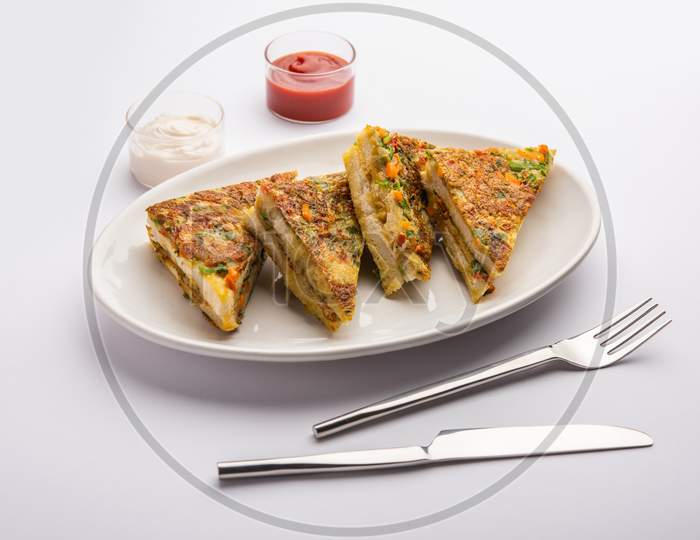 Bread Omelette Is A Quick And Easy Breakfast From India. Fresh Bread Slices Dipped Into Egg Batter With Spices And Shallow Fried. Served With Tomato Ketchup And Tea