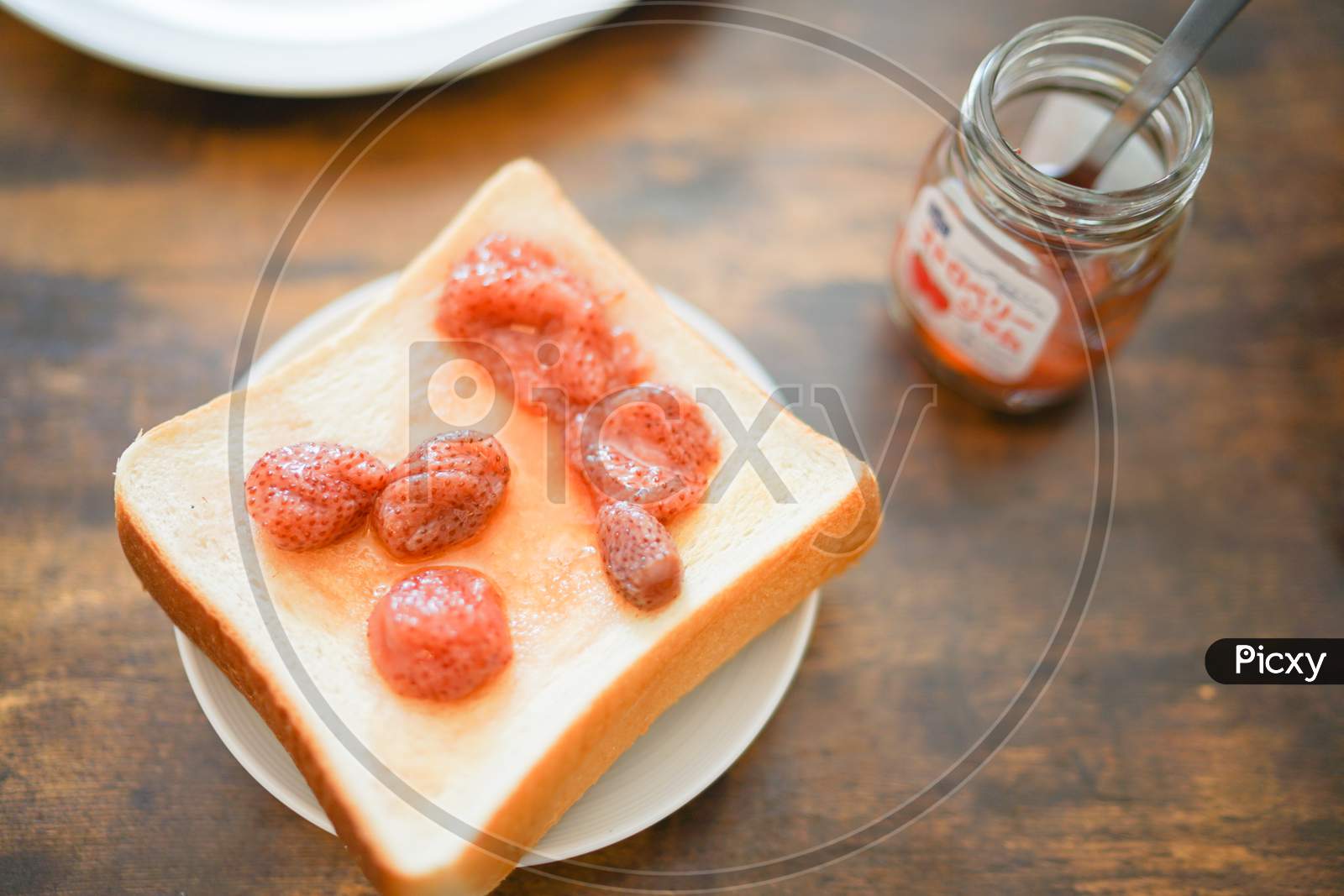 Strawberry Jam And Thick Bread