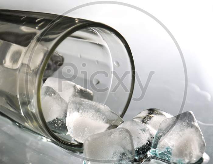 Ice Cubes In Glass Isolated On White