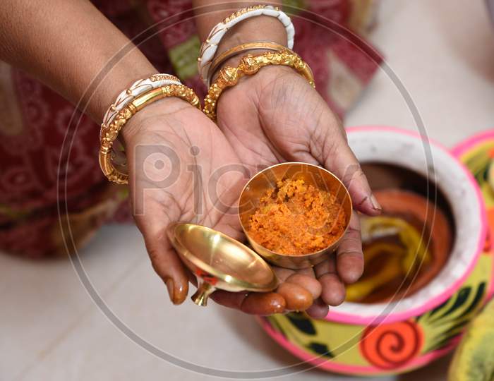 Showing Of Haldi Or Turmeric Paste In Indian Bengali Marriage Ceremony.