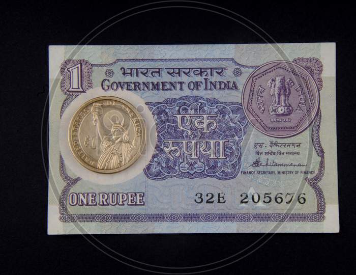 Indian Rupee Note And American Dollar Coin