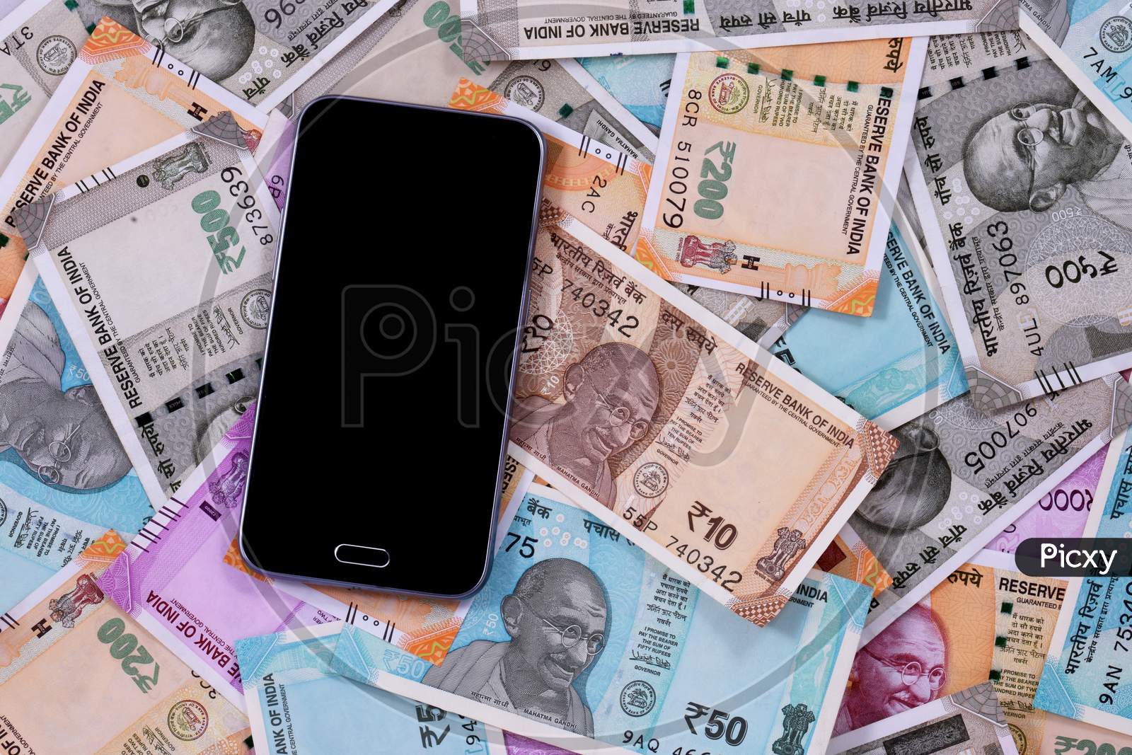 Mobile Smart Phone And Indian Rupee Notes, Digital Money,Fin-Tech,Money Making Online Concepts.
