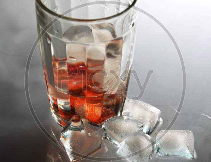 Glass Of Soda Water With Ice Cubes