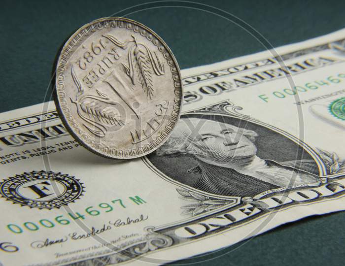 Indian Rupee Coin And American Dollar Note