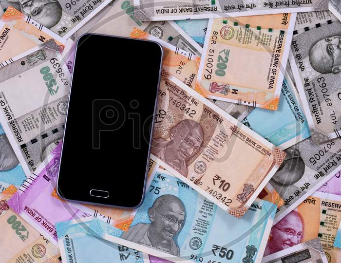 Mobile Smart Phone And Indian Rupee Notes, Digital Money,Fin-Tech,Money Making Online Concepts.