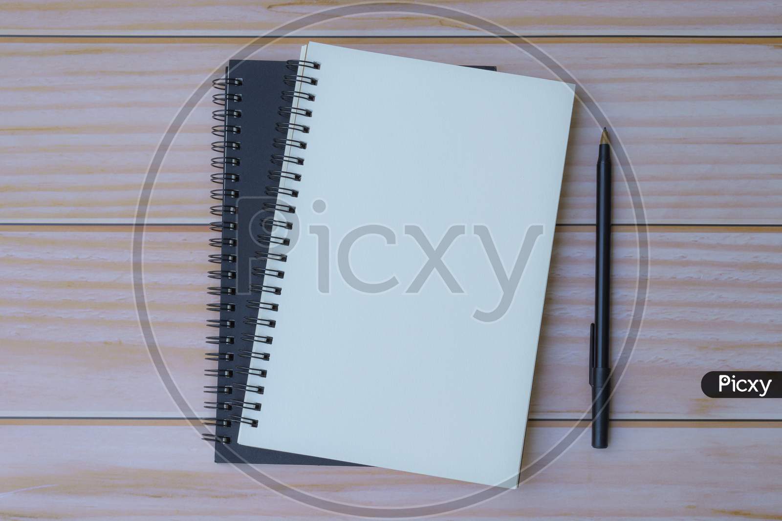 Note Book With Pen On Wooden Table. Flat Lay, Top View