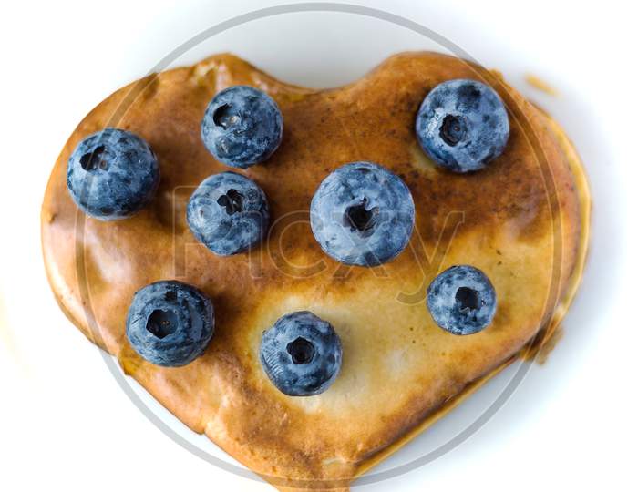 Healthy Food Concept Displaying Image Of Full Heart Shape Pan Cake With Blueberries Fruit On Top Isolated On White Background