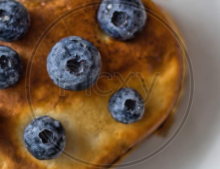 Healthy Food Concept Displaying Vertical Image Of Half Heart Shape Pan Cake With Blueberries Fruit On Top Isolated On White Background