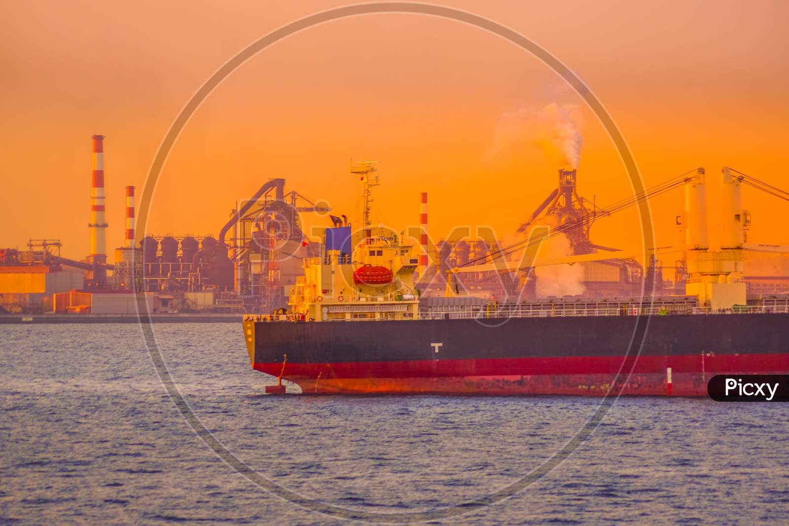 Cargo Ship Silhouette And Sunset