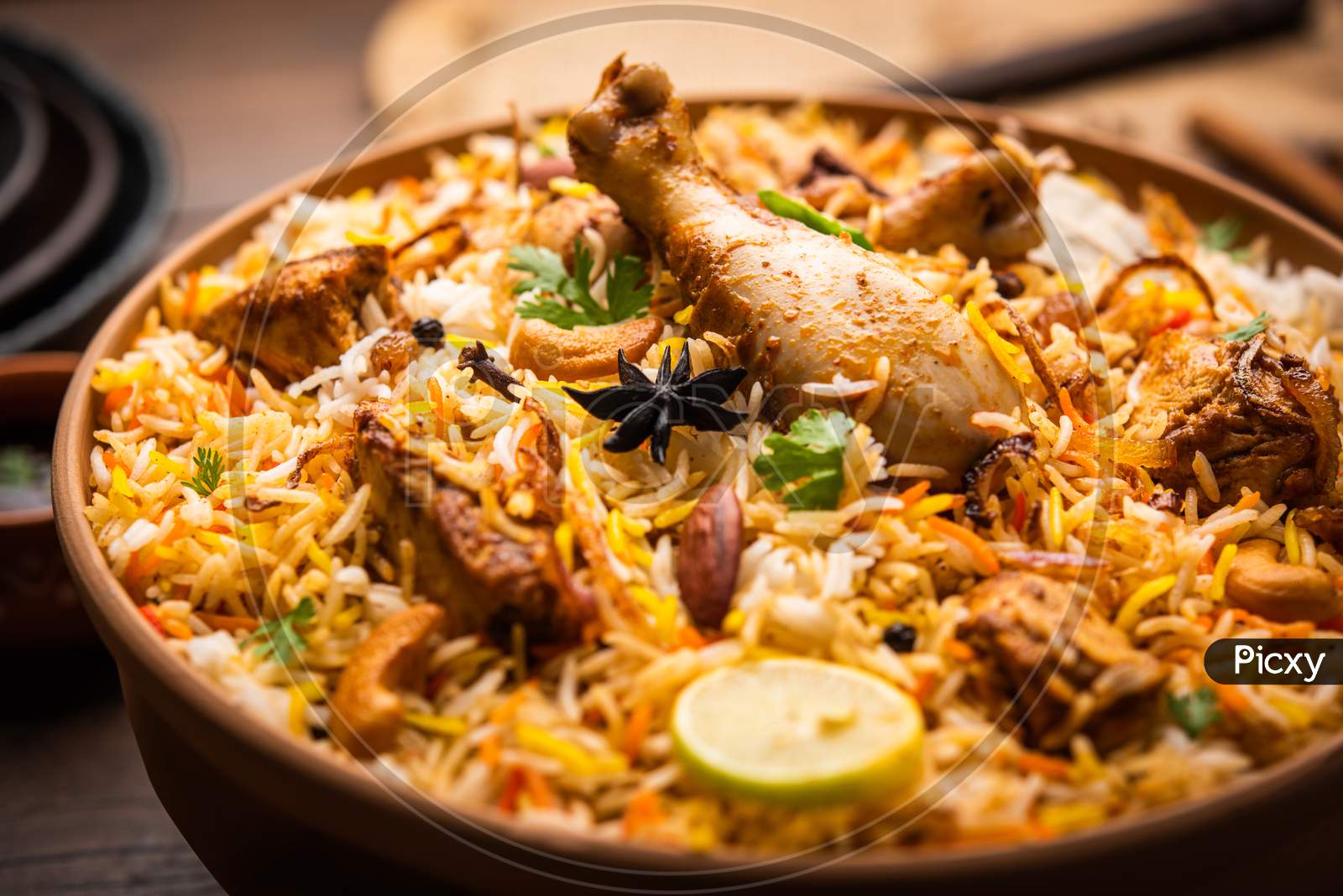 image-of-dum-handi-chicken-biryani-is-prepared-in-an-earthen-or-clay