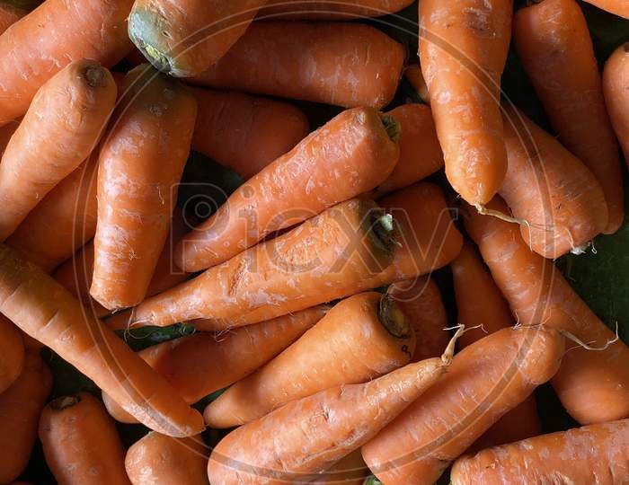 Carrots piled in a shop of local market