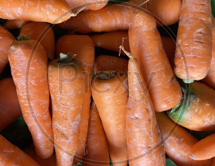 Carrots piled in a shop of local market