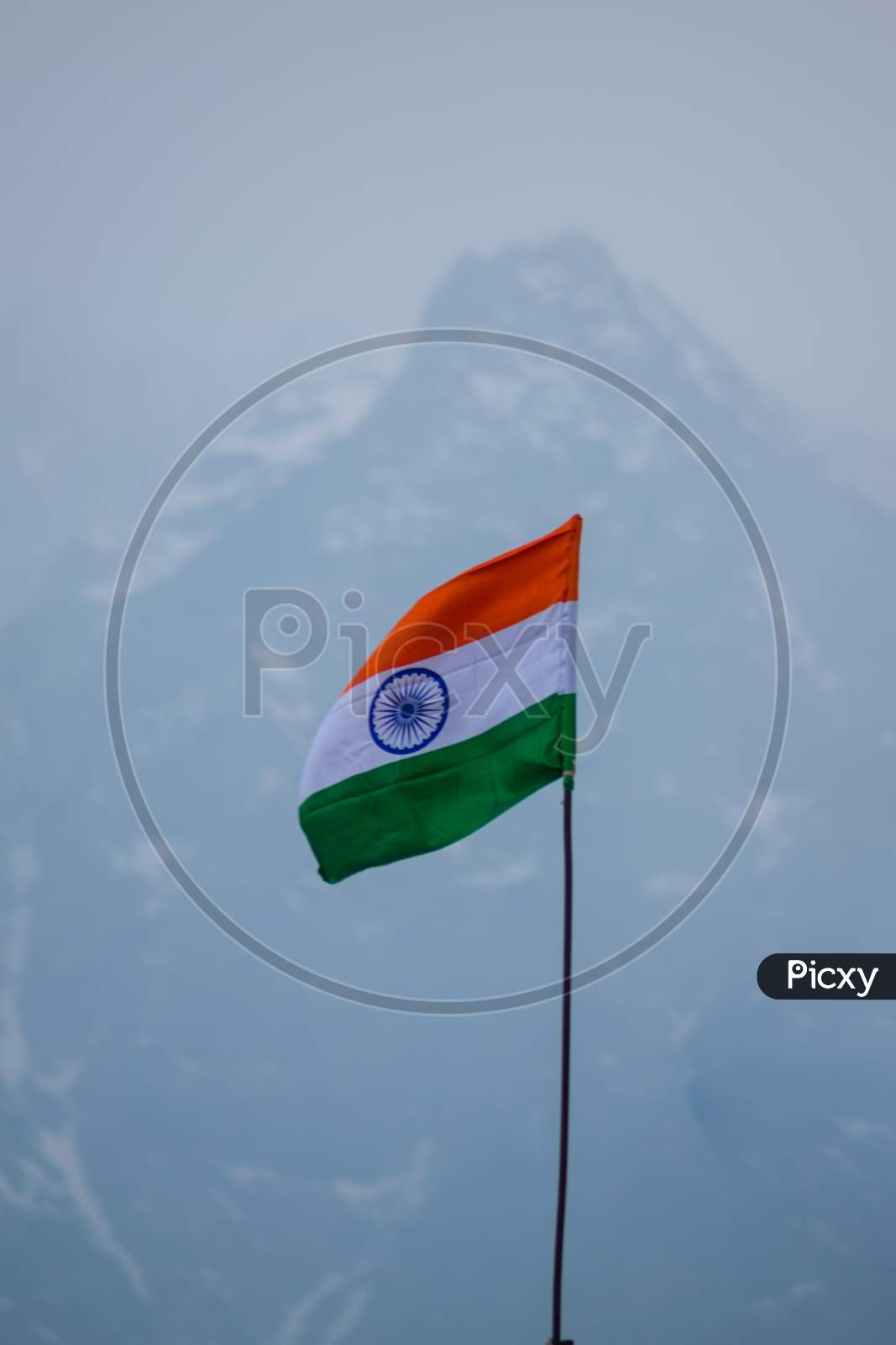 Tricolor Flag In The Himalayas Being Waves By The Winds