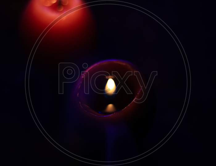 lighting candles with smoke, Burning smoky candle on black background, Candle in the dark, Design for the background and wallpaper. copy space.