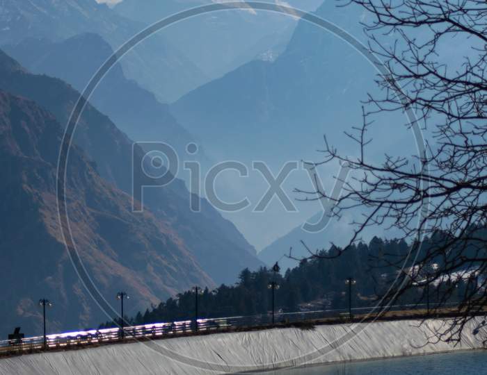 View Of Lake With Nanda Devi Peak On A Bright Sunny Day In Uttarakhand