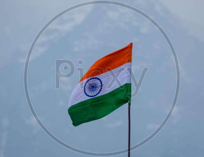 Tricolor Flag In The Himalayas Being Waves By The Winds