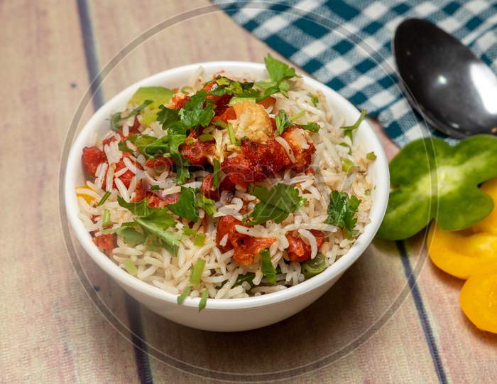 Gobi Fried Rice With Capsicum And Coriander On Top