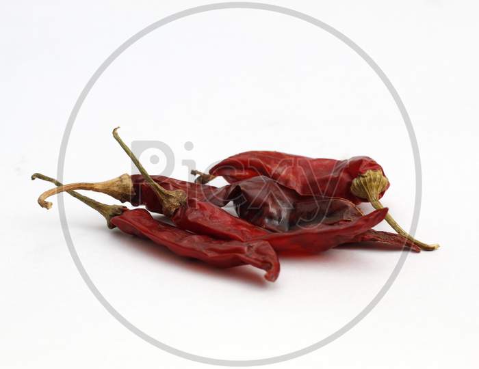 Red Chillies on a white background