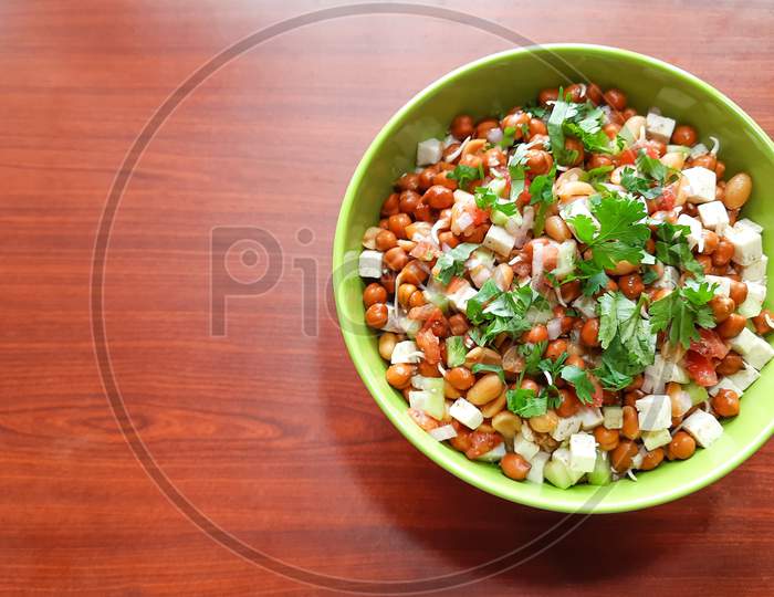 Sprouts Salad With Green Coriander In A Green Bowl On Wooden Table