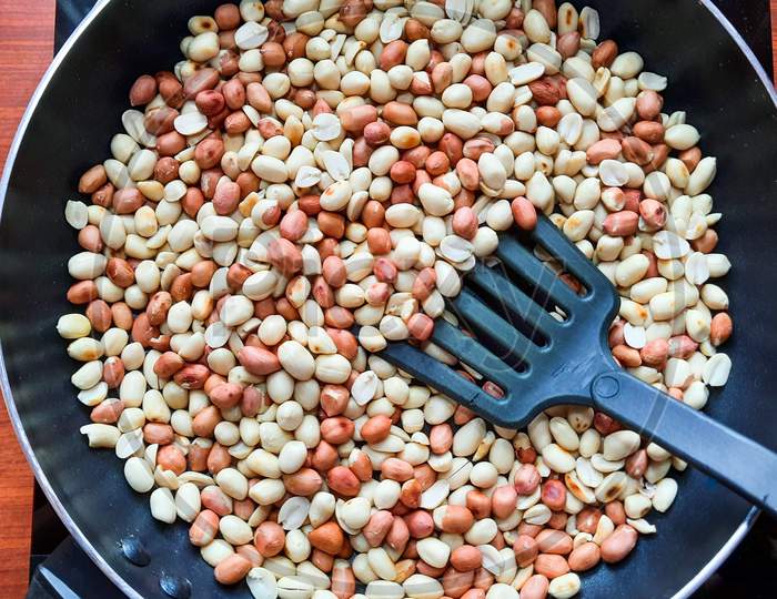 Roasting Peanuts In A Frying Pan On A Induction Cookware