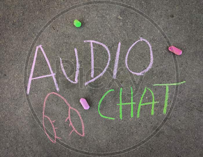 The Inscription Text On The Grey Board, Audio Chat With Hand Drawn Head Phone. Using Color Chalk Pieces.