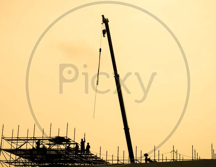 Of Large Crane Silhouette And Sunset