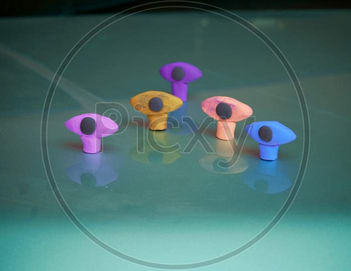 Five Eyes Shaped Clay Model Presented With Reflection On Gray Background