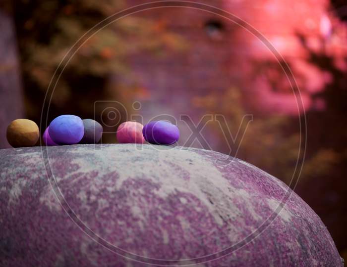Colorful Clay Balls Presented Around Garden Background