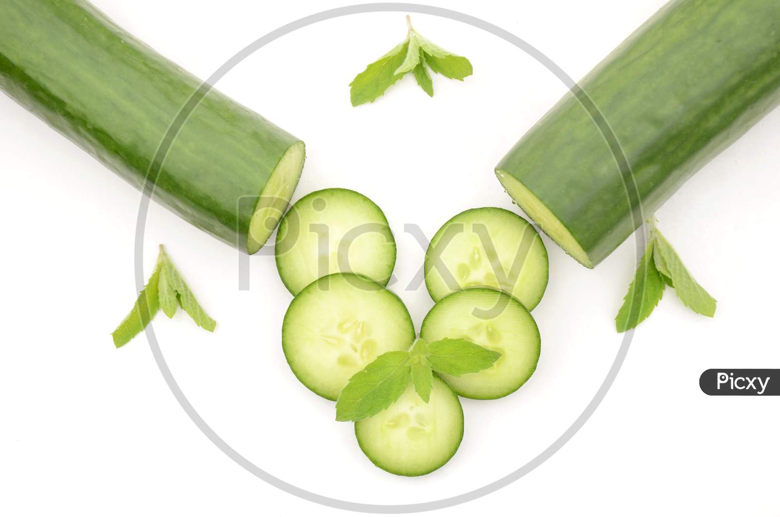 Closeup Sliced Green Ripe Cucumber With Mint Isolated On White Background.