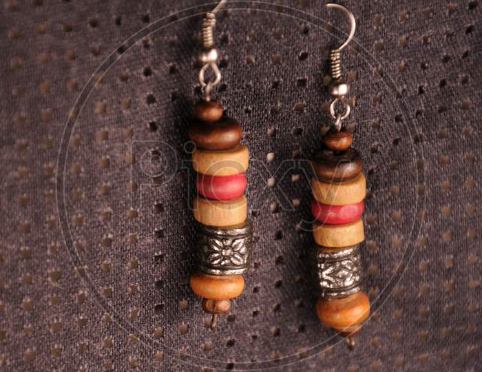 Close-Up Of A Pair Of Wooden Earrings
