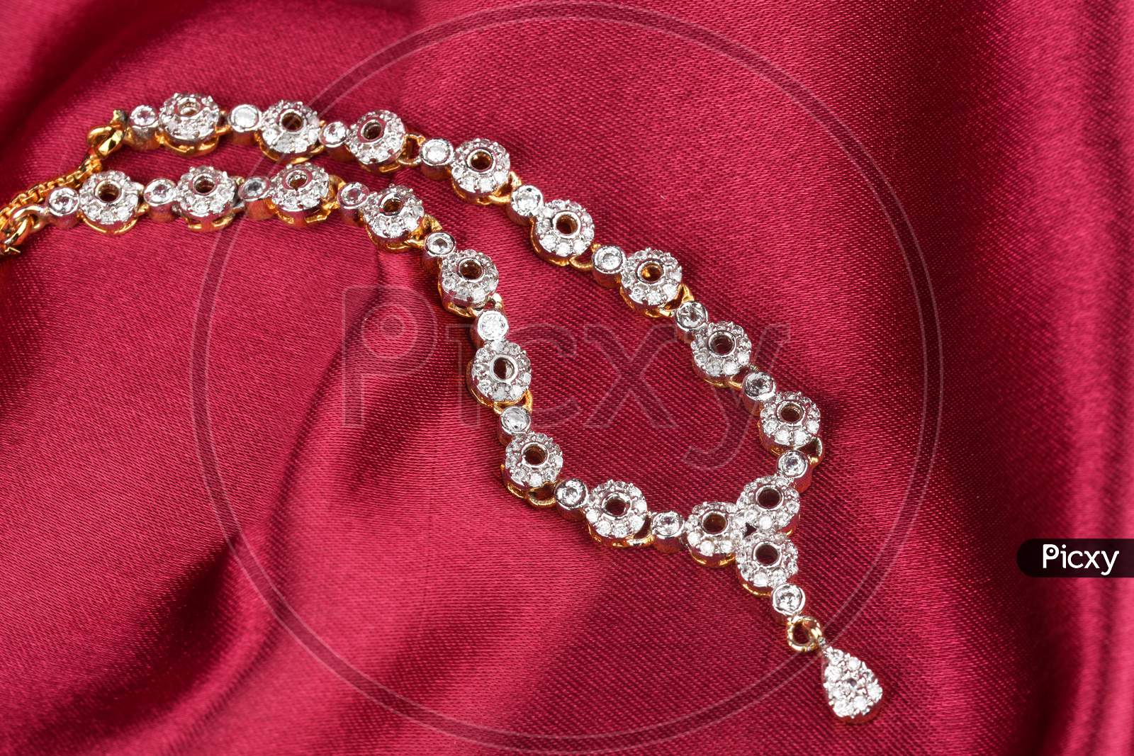 Diamond Jewelry Placed On Cloth, Diamond Pendant,Diamond Jewellery, Diamond Necklace