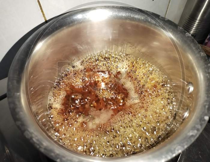 Boiling tea , black tea , tea in a pan