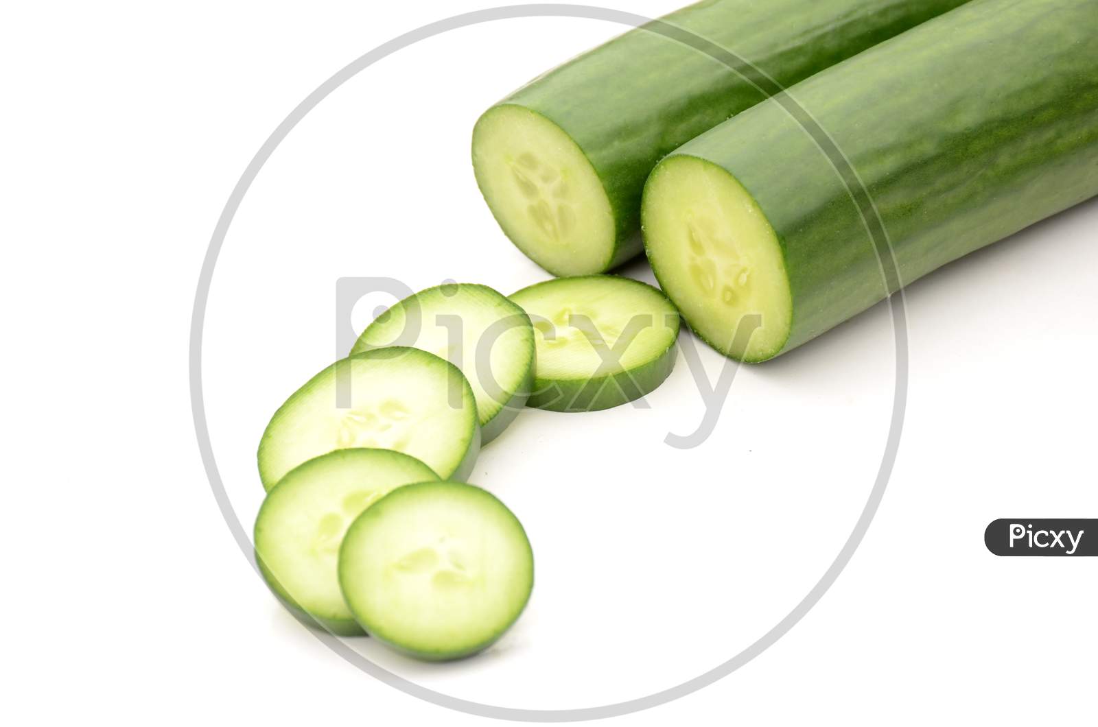 Closeup The Pair Of Sliced Green Ripe Cucumber Isolated On White Background.