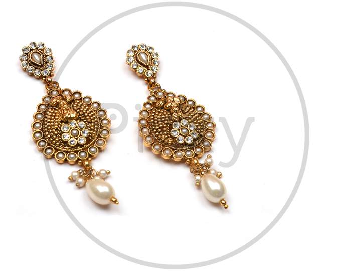 Beautiful Golden Pair Of Earrings,Pearls Earrings On White Background. Luxury Female Jewelry, Indian Traditional Jewellery, Kundan Earring,Bridal Gold Earrings Wedding Jewellery